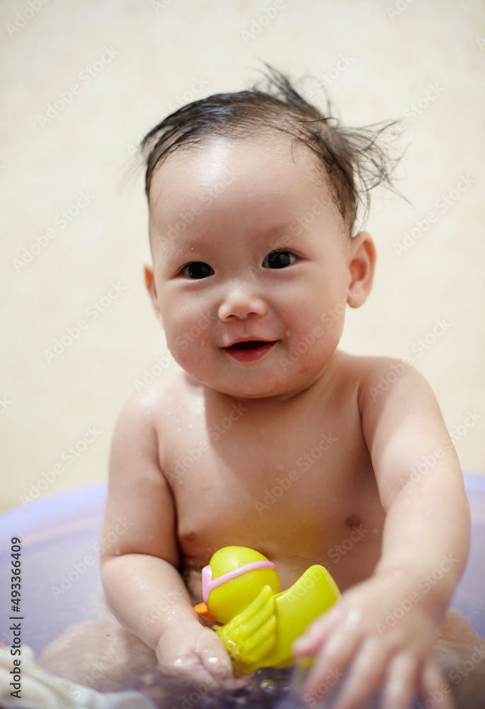 Asian little baby playing with toys in bath
Asian little baby playing with toys in bath
