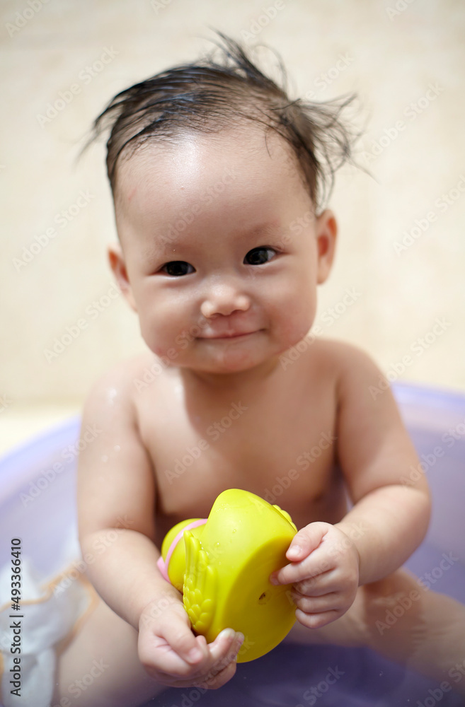 Asian little baby playing with toys in bath
Asian little baby playing with toys in bath