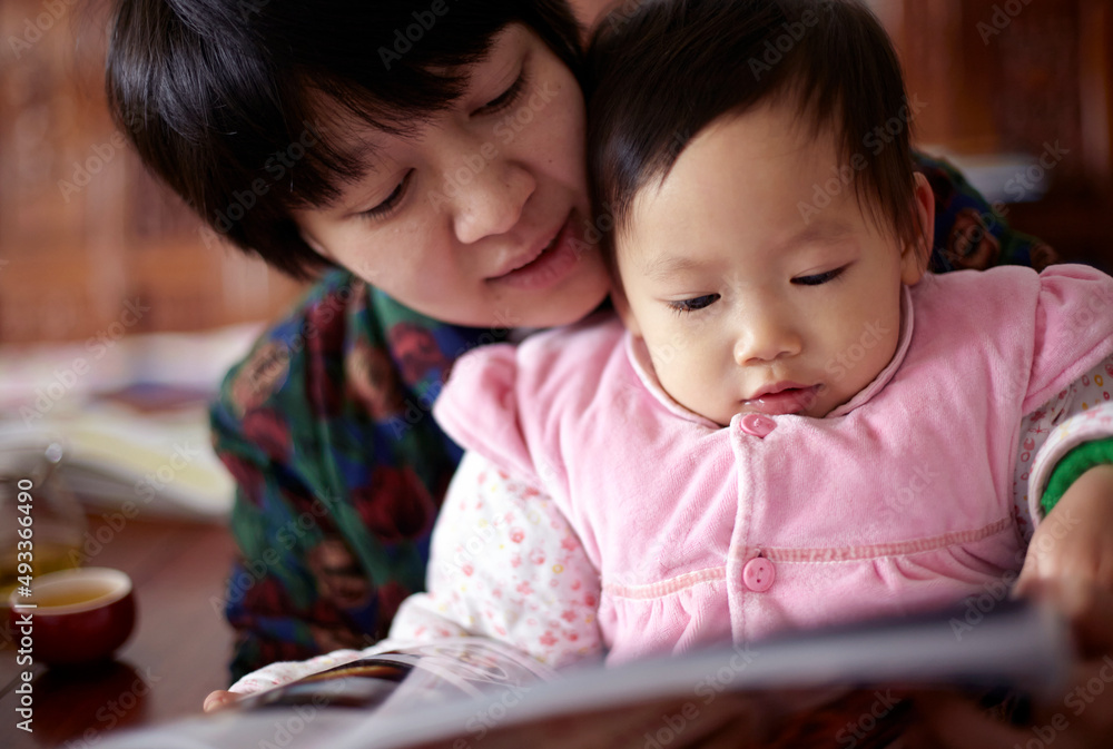 Cute asian baby and mother are reading picture book
Cute asian baby and mother are reading picture book