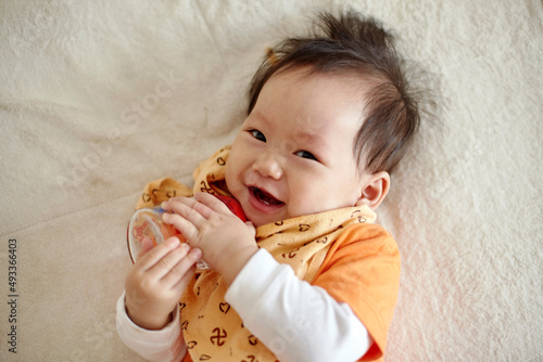 Closeup cute asian kid with funny expression

 photo