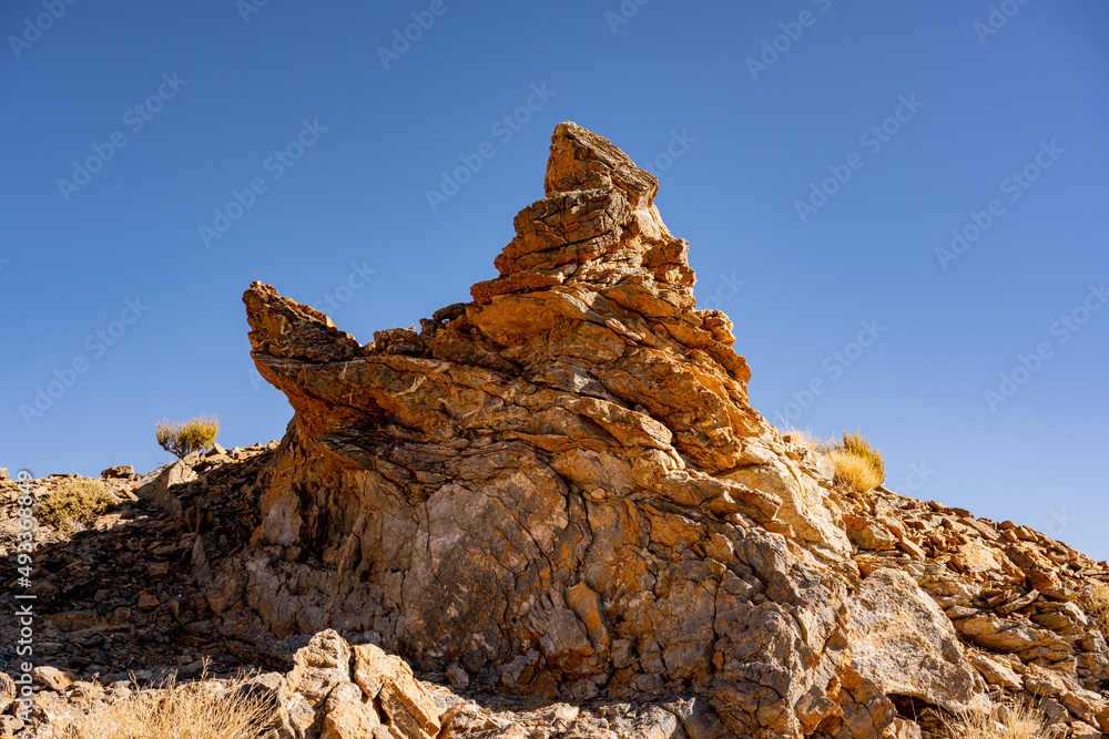 Sharp Rock Formation Against A Blue Sky on Corkscrew Peak