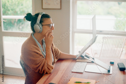 Working at home using laptop stand photo