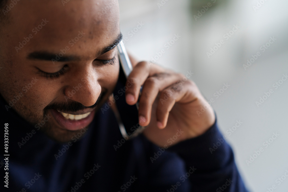 Smiling man talking on smartphone Smiling man talking on smartphone