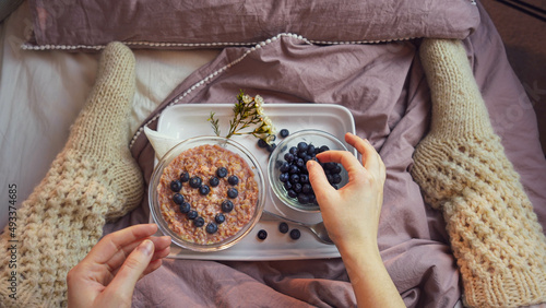 blueberry heart on oatmeal porridge photo