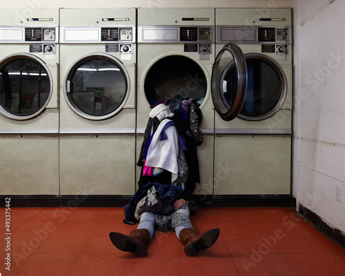 Overwhelmed Woman Doing Laundry