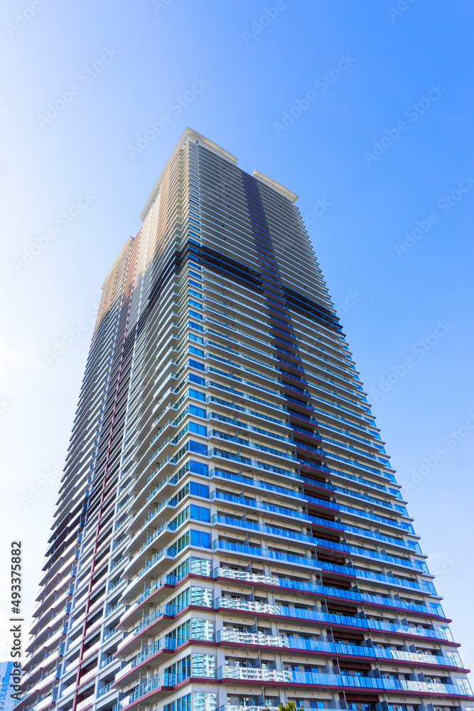 Landscape photograph looking up at a high-rise apartment_c_11