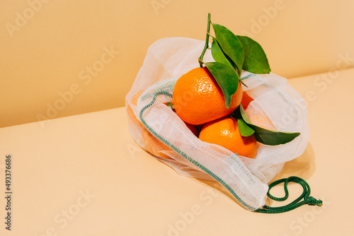 Oranges in mesh bag photo