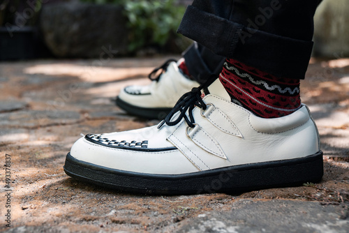These white creepers with black-and-white webbing are made of genuine leather with black soles, these elegant and luxurious sneakers are made by a home craftsman.