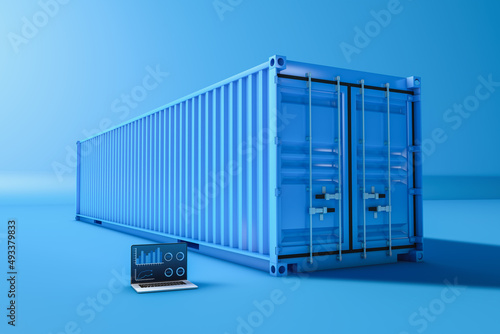 Cargo container next to a laptop photo