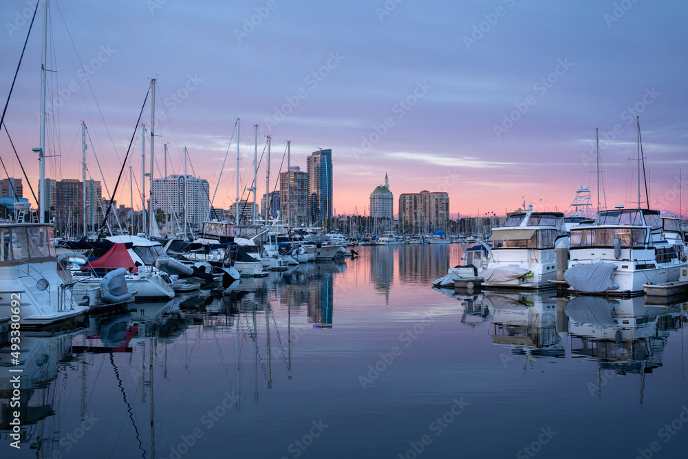 Marina in Long Beach, California, during beautiful sunset, boats and yachts on the water