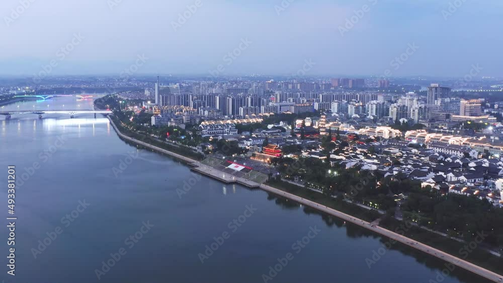 aerial view of ancient architecture near river in quzhou at night
aerial view of ancient architecture near river in quzhou at night
