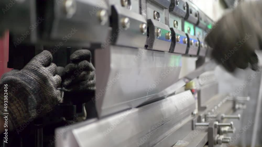 Bending metal sheet by sheet bending machine. Violation of safety rules
