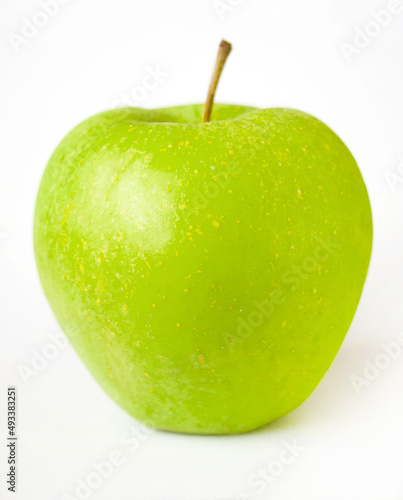 Sample ripe green apple, sample of fruit variety. Green whole fresh apple with stem and shadow on white background.