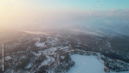 Aerial Over Snow Covered Landscape At Tatra National Park. Establishing Shot, strsbke pleso, Slovakia photo