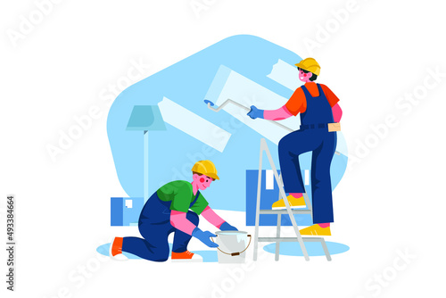 Construction worker painting wall