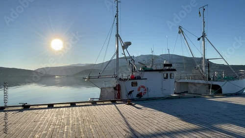 View of a Fishing boat at Fauske Pier, Northern Scandinavia, Norway, bright sunny day. photo