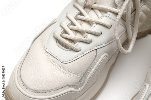 White leather sneakers on a white background.