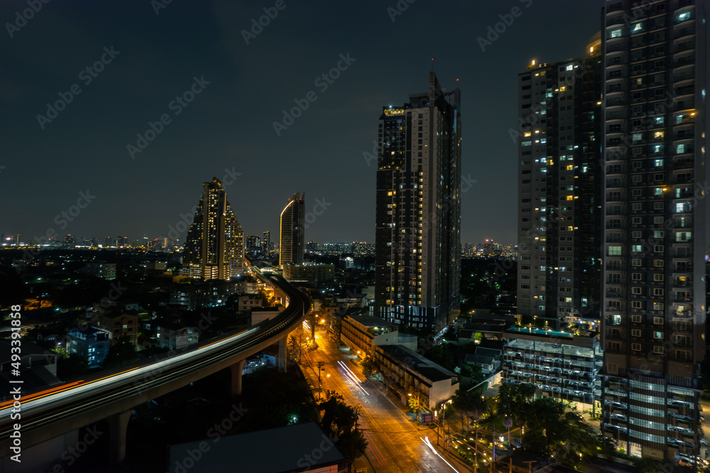 aerial view of Towers business area on night Business District Low Light, Over Urban Junction concept or abstract of advanced innovation, financial technology, energy power	