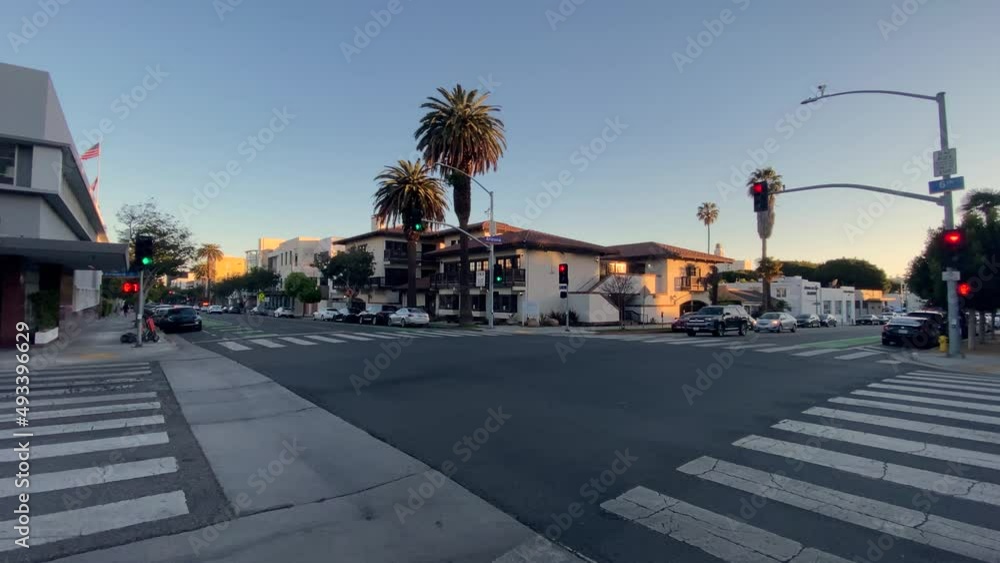 Traffic at 6th street intersection with palm trees in downtown Santa Monica, sunny evening in Los Angeles, USA - static view Traffic at 6th street intersection with palm trees in downtown Santa Monica, sunny evening in Los Angeles, USA - static view