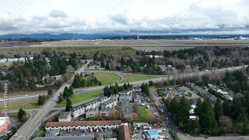 Cinematic 4K aerial drone trucking shot of airplane landing at the Seattle-Tacoma International Airport KSEA photo