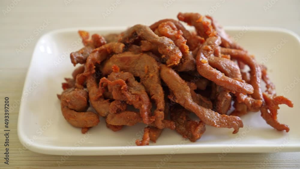 Sun-Dried Pork on white plate - Asian food style Sun-Dried Pork on white plate - Asian food style
