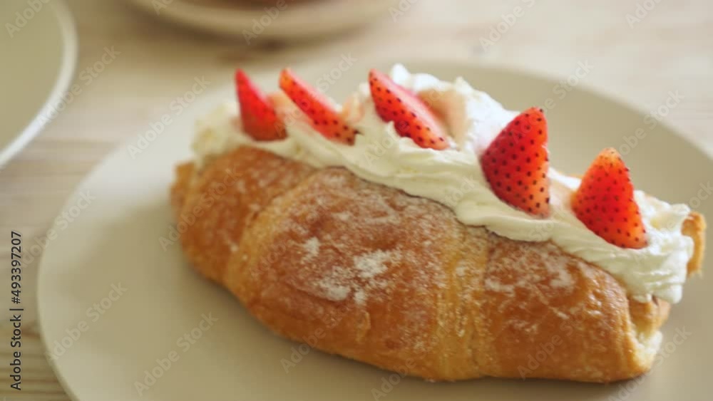 strawberry and fresh cream croissant on plate strawberry and fresh cream croissant on plate