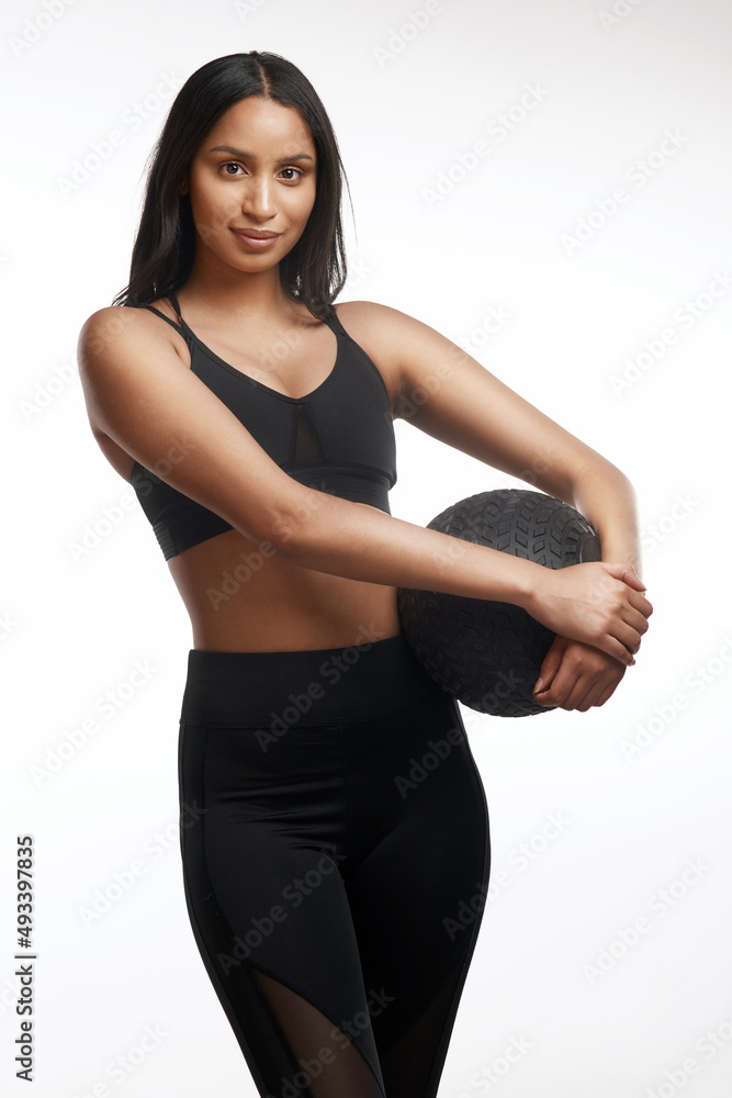 Be somebody nobody thought you could be. Studio portrait of a sporty young woman holding an exercise ball against a white background. Be somebody nobody thought you could be. Studio portrait of a sporty young woman holding an exercise ball against a white background.