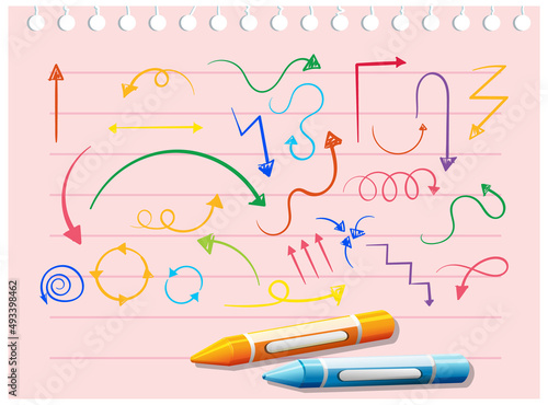 Coloured arrow doodles on paper with crayons