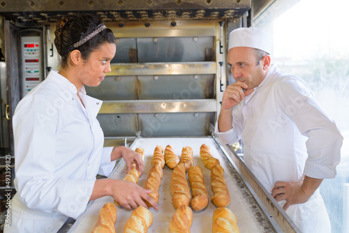 man and woman working in a bakery