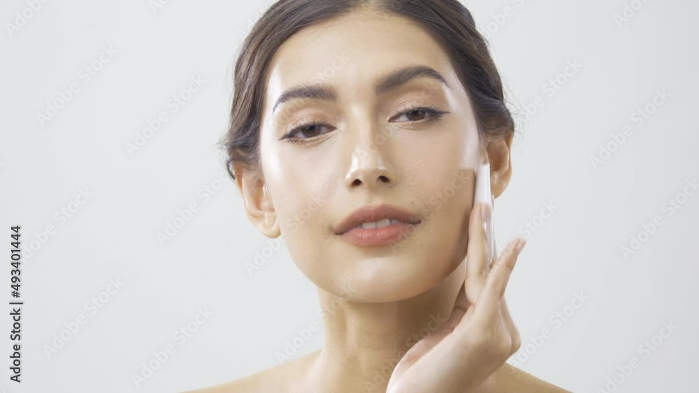 Portrait of beautiful woman at white background. Beautiful woman with perfect makeup. She smiling and looking to camera. Portrait of beautiful woman at white background. Beautiful woman with perfect makeup. She smiling and looking to camera.