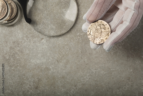 Numismatics. Collectible silver coins of the times of Tsarist Russia on the table.