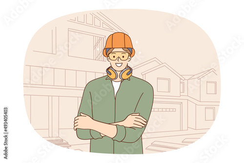 Smiling male constructor in protective gear at house construction site. Happy man engineer or housebuilder in helmet and headset at project yard control building. Flat vector illustration. 