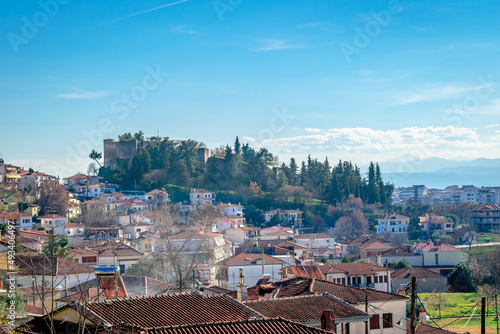 Panoramic view of the old town of Trikala, in Thessaly, Greece, with the hill of Profitis Ilias and the medieval byzantine castle. photo