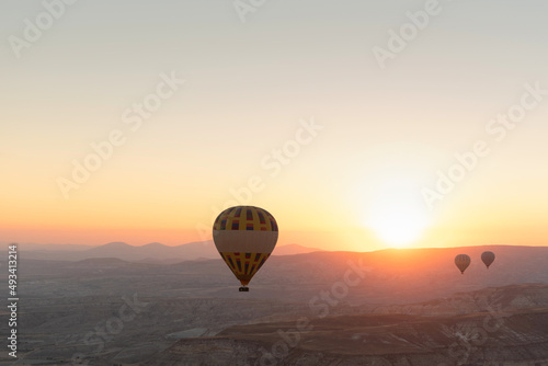 Hot air balloons in the sky during sunrise. Travel  dreams come true concept