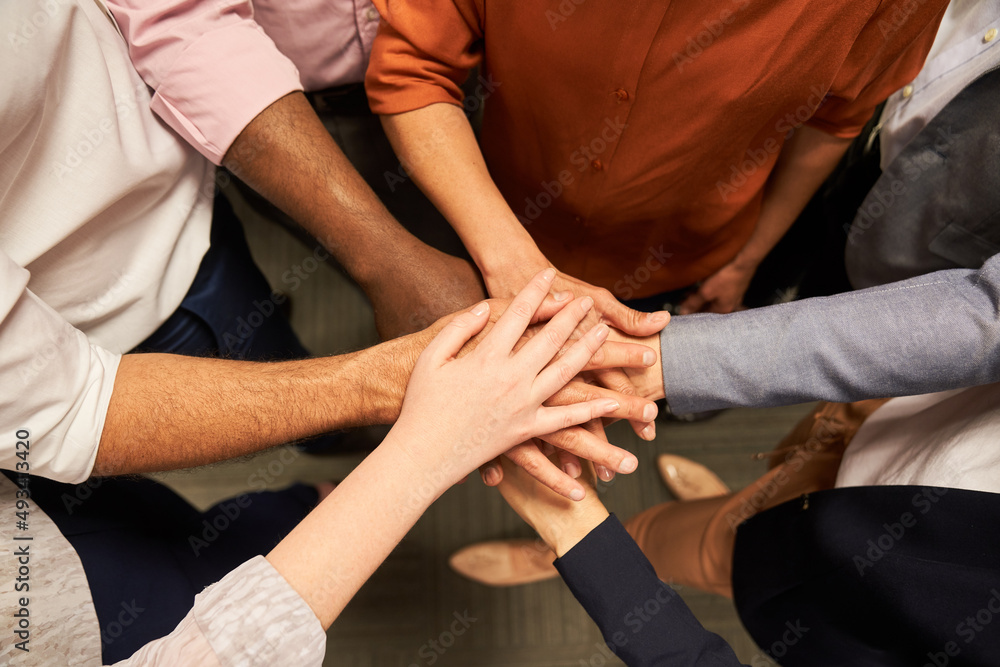 Hands stacking for team building and collaboration Hands stacking for team building and collaboration