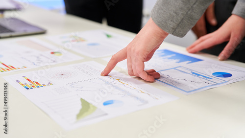 Business man pointing to data in financial analysis