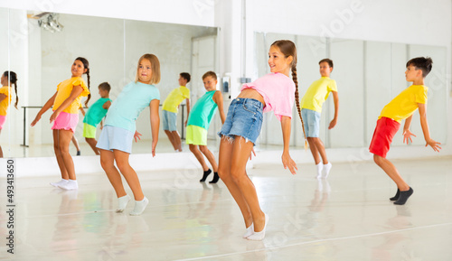 Happy kids having fun in a choreography studio during dance lesson