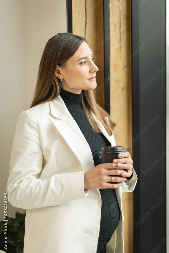 young woman sitting in a cafe at a table