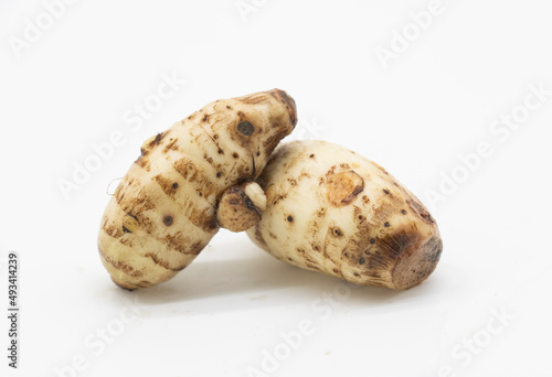 Closeup fresh taro root or Arbi on white background, it's have full on calcium and iron.