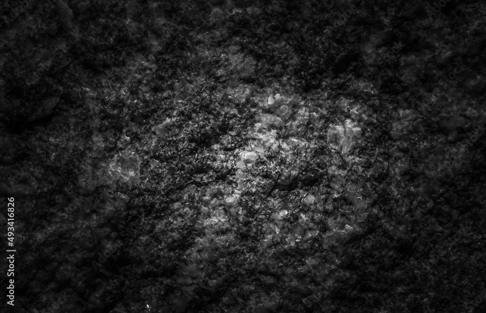 Fototapeta premium Dark textured stone background. The texture of the stone.