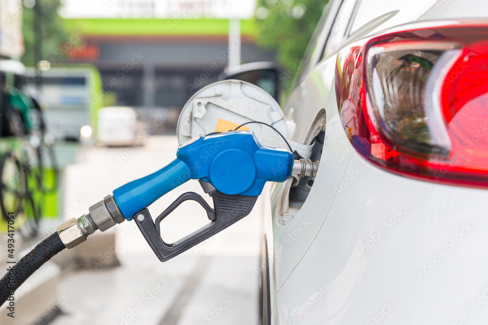 Refill and filling Oil Gas Fuel at station. Gas station refueling. To fill the machine with fuel. Car fill with gasoline at a gas station. Gas station pump. Refill and filling Oil Gas Fuel at station. Gas station refueling. To fill the machine with fuel. Car fill with gasoline at a gas station. Gas station pump.