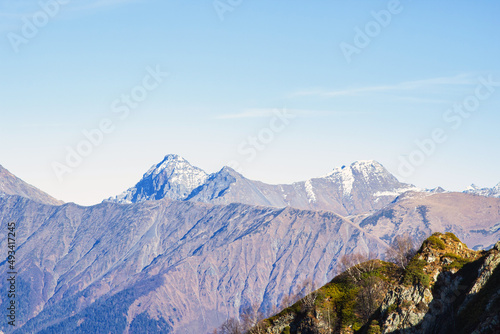 Landscapes in the mountains near Sochi in Russia. High mountain peaks and valleys in the rays of the sun in autumn. © Dancer01