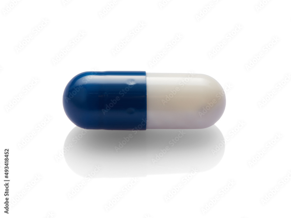 Blue capsule isolated on white background.
