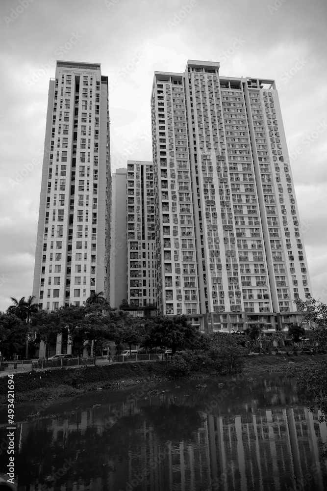 Fototapeta premium High rise residential building at the river in HCMC city