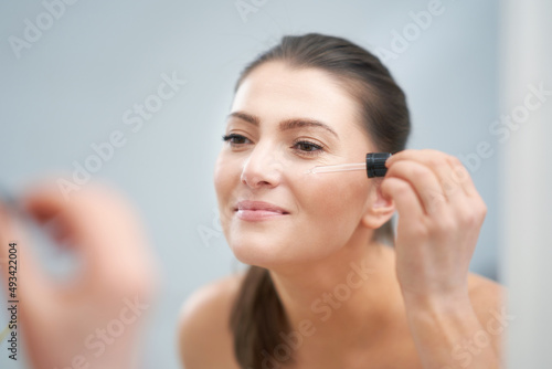 Young nice brunette woman in the bathroom