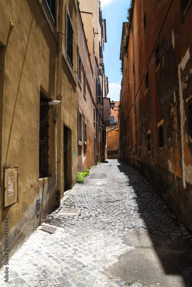 Empty narrow streets of Rome, Italy. Traditional, picturesque Roman alley.