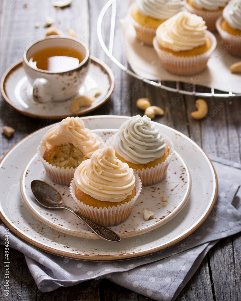 Vanilla cupcakes with pastel colored cream Vanilla cupcakes with pastel colored cream
