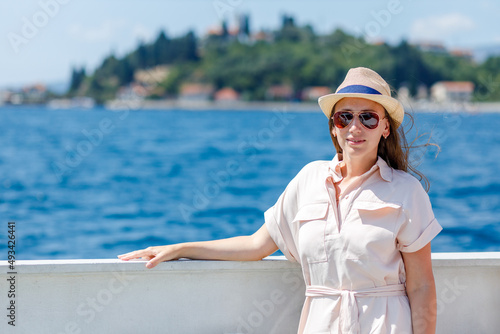 Young lady in dress travelling by ship on her vacation cruise in europe © skumer