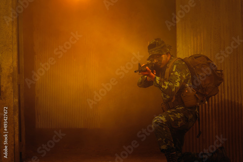 Army soldier with rifle and machine gun.