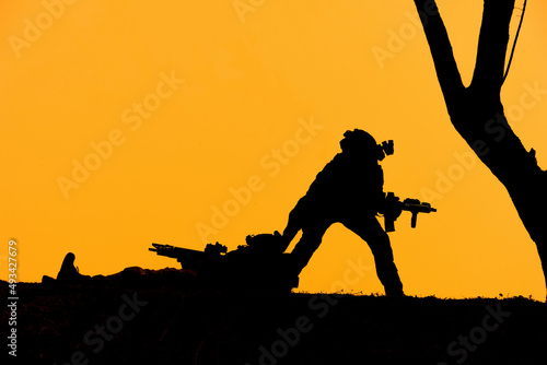 Silhouette soldiers hold weapons military. war and danger concept.